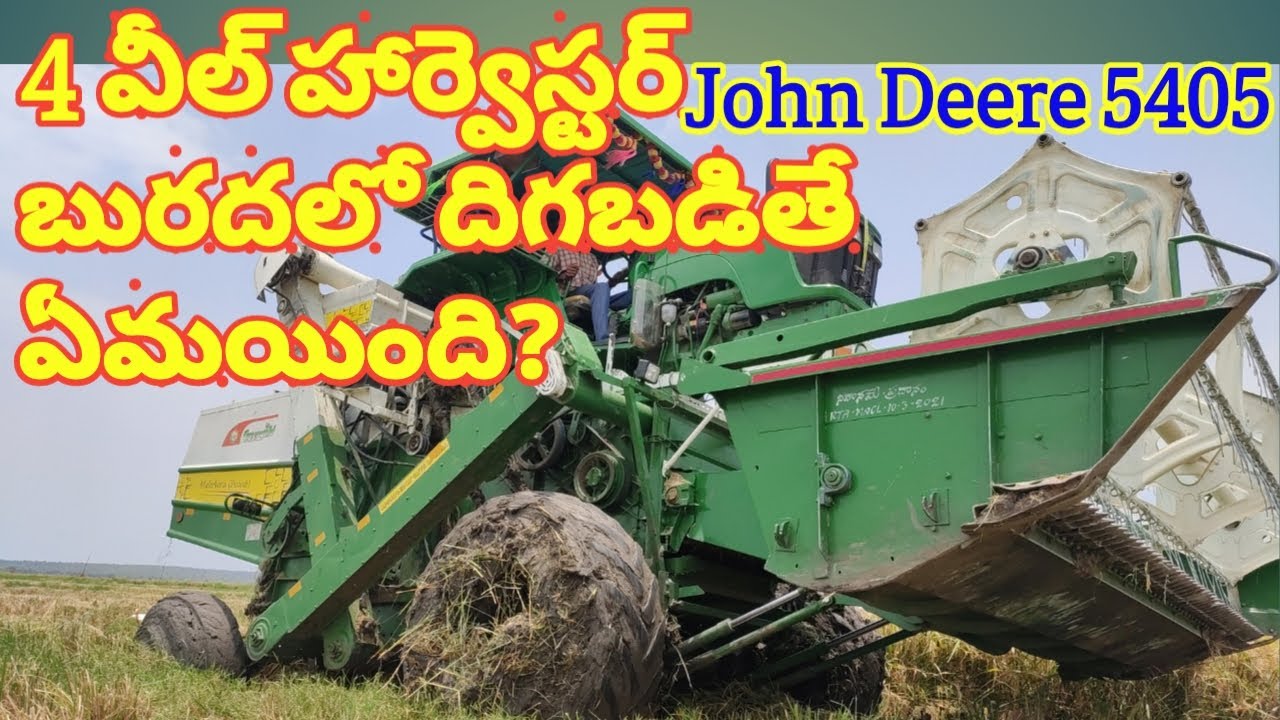 John Deere 5405 4WD Harvester stuck in Mud