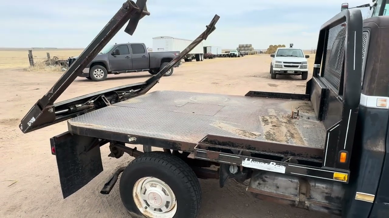 1984 GMC 3500 with Hydrabed lot #91 selling on our Online 2026 Spring Consignment Sale
