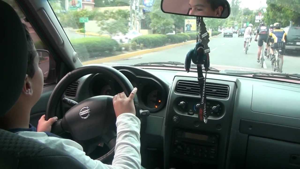 Small kid driving dad's car