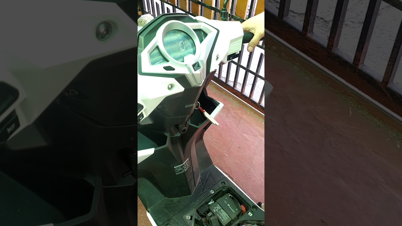 Honda new elite Fi 125 cambio de bujia
