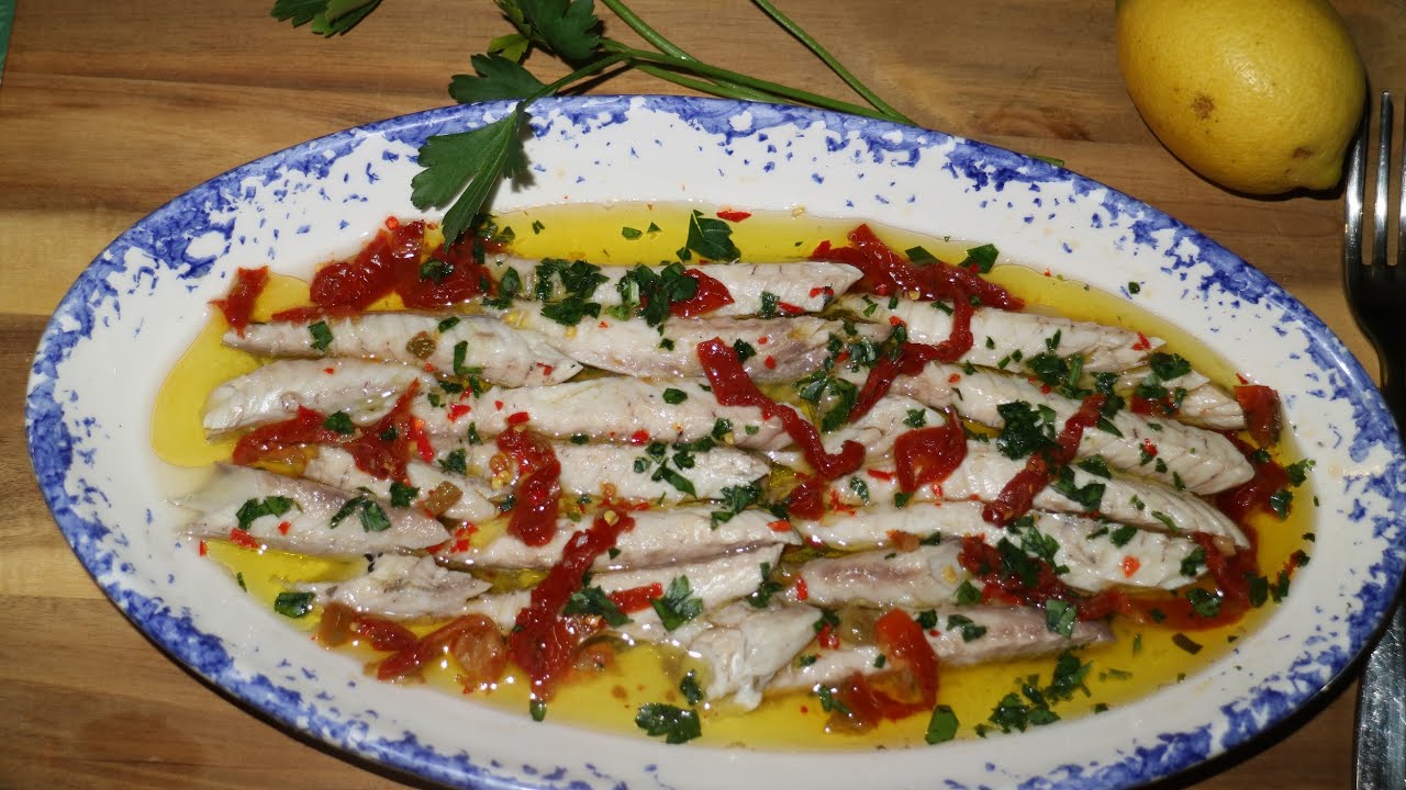 Sgombri lessati  conditi con olio e limone