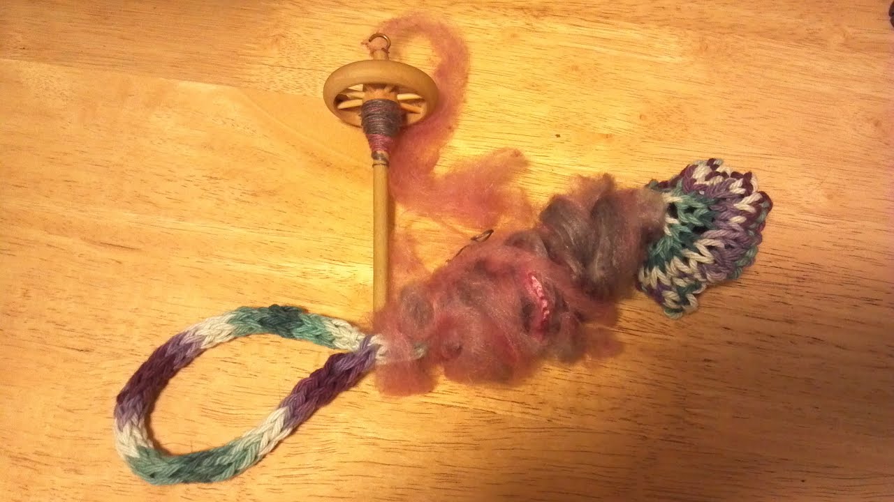 Drafting and spinning silk hankies on a drop spindle