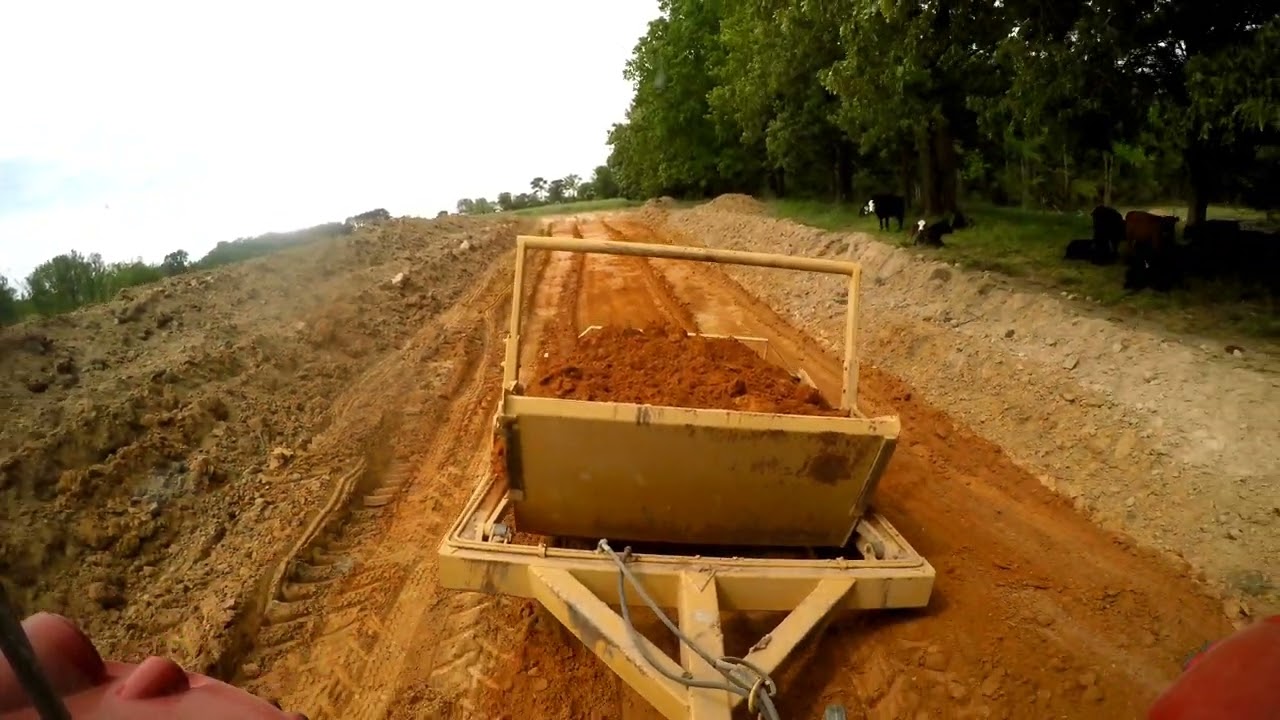massey ferguson 5465 pulling 5 yard dirt pan
