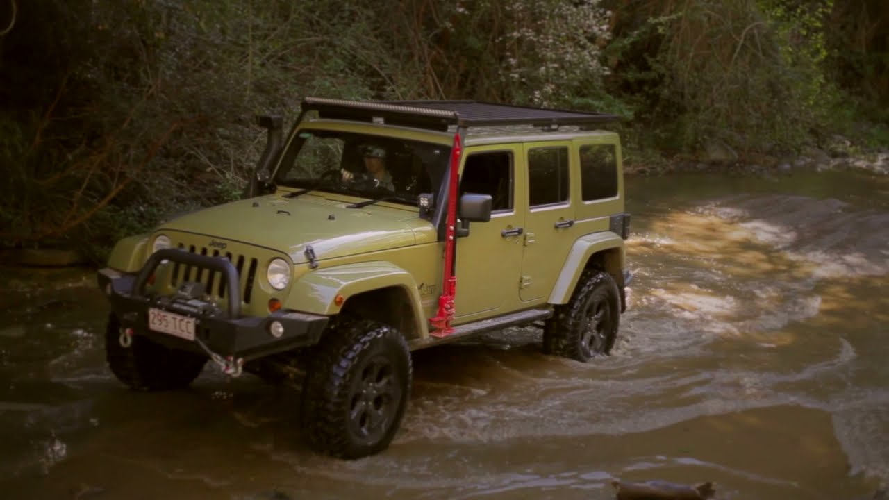 Watch Jeep Wrangler JK Rock Crawling in an old River Bed