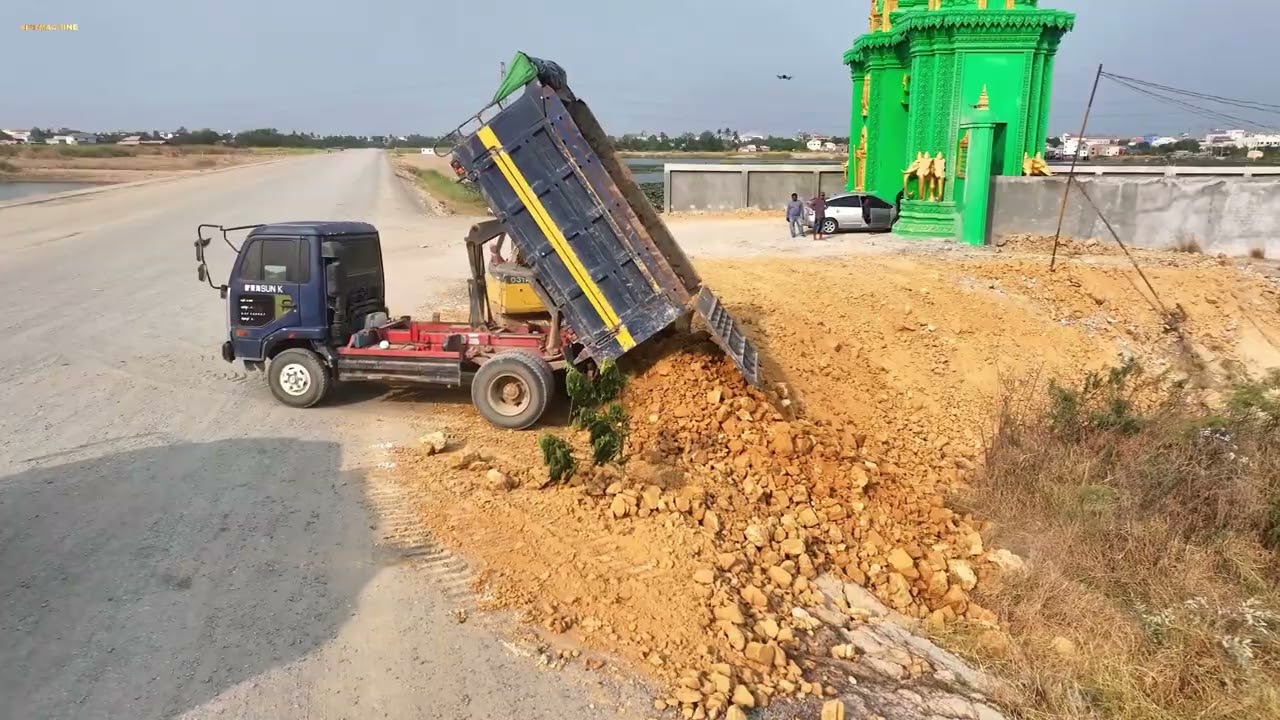 Start project by dozer Komatsu D31A, pushing the soil, holding the fence to prevent it from falling.