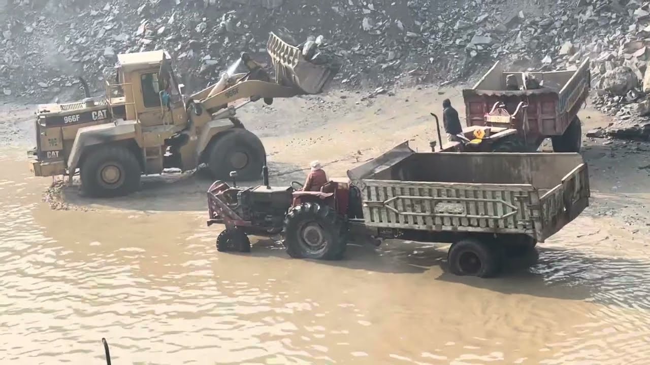 Biggest Double Caterpillar Loadar D966 g F950 Working in Mountain: Trolley load up caterpillar stone