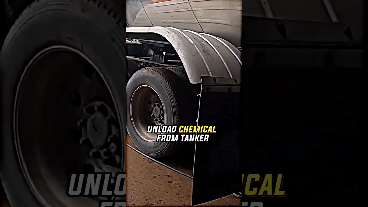 TRUCK DRIVER UNLOADING A TANKER THAT HAS CORROSIVE CHEMICAL.