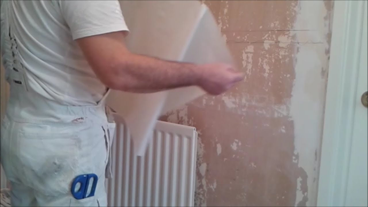 How to hang lining paper behind a radiator
