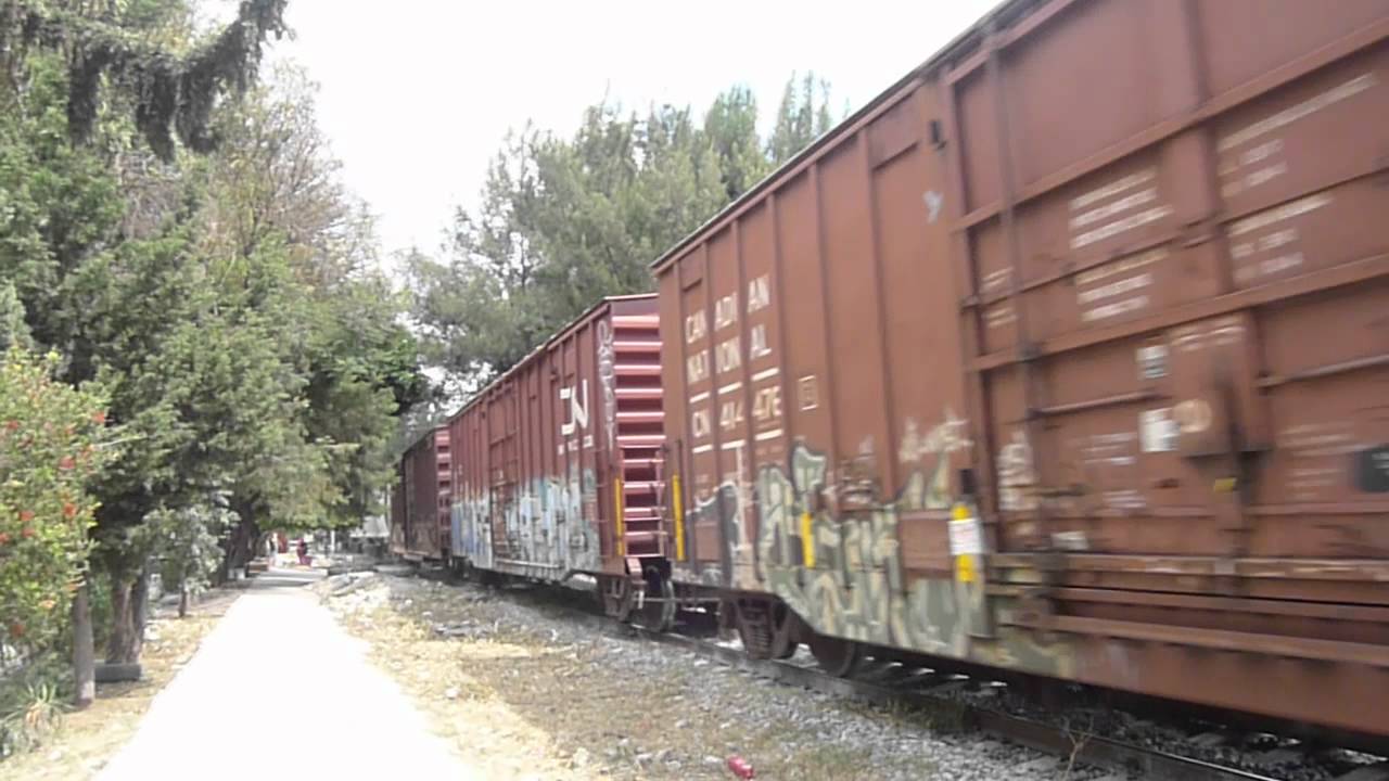 Ferrovalle freight train with armed guards riding caboose - Mexico City