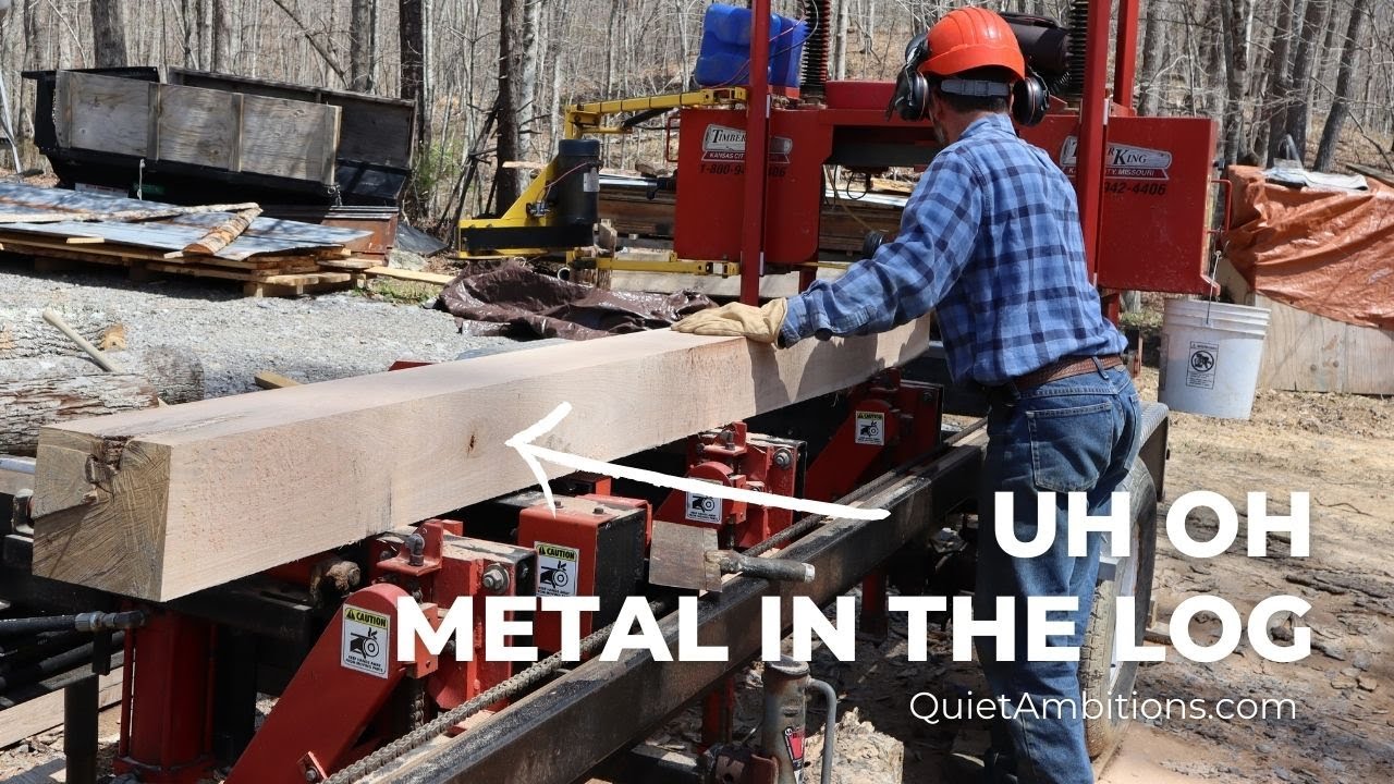 Oops found metal in the log. Sawmilling a nice white oak log; it had a surprise for Tim.