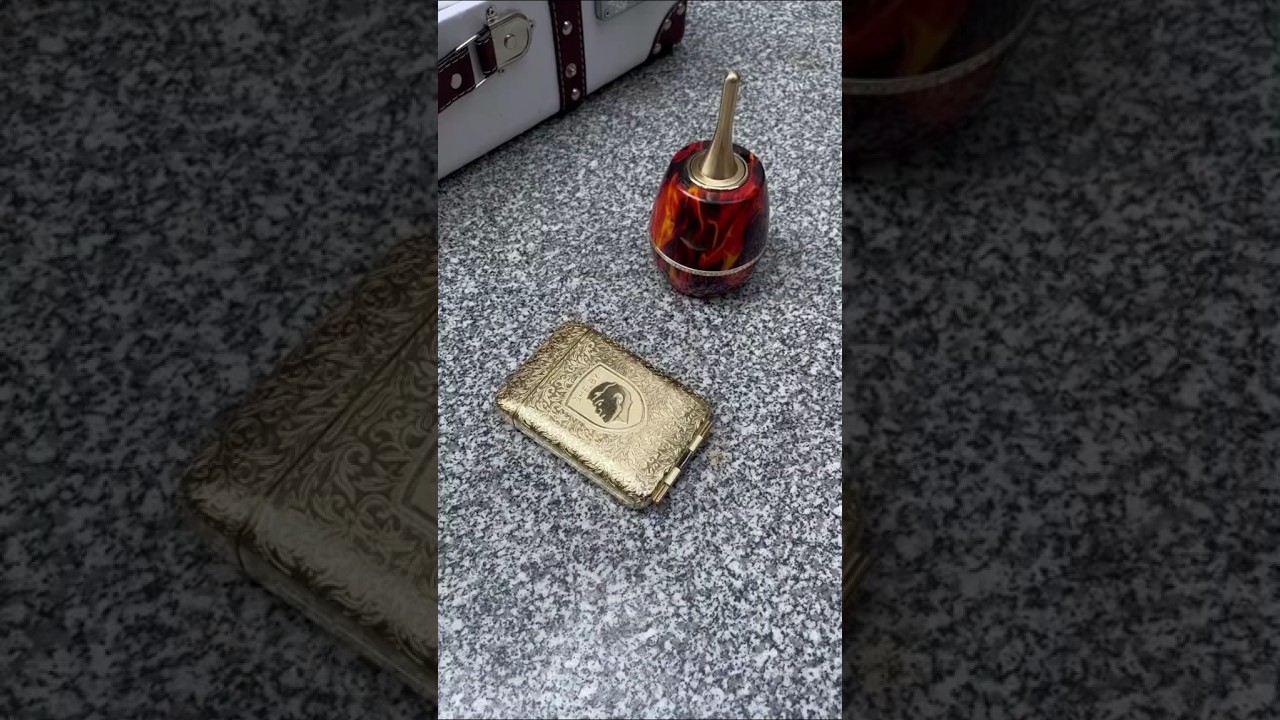 Red vase lighter and gold-colored case