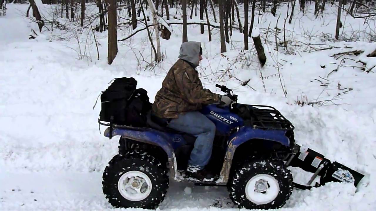Grizzly 660 Plowing Snow