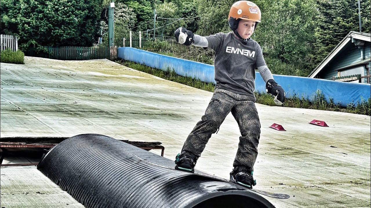 Siblings first dry slope snowboarding