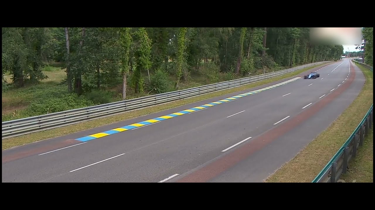 Fernando Alonso laps the LeMans racetrack onboard an Alpine F1 car. Alonso F1 LeMans 2021