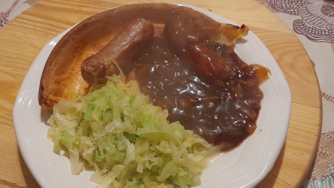 Toad in the hole with onion gravy and cabbage