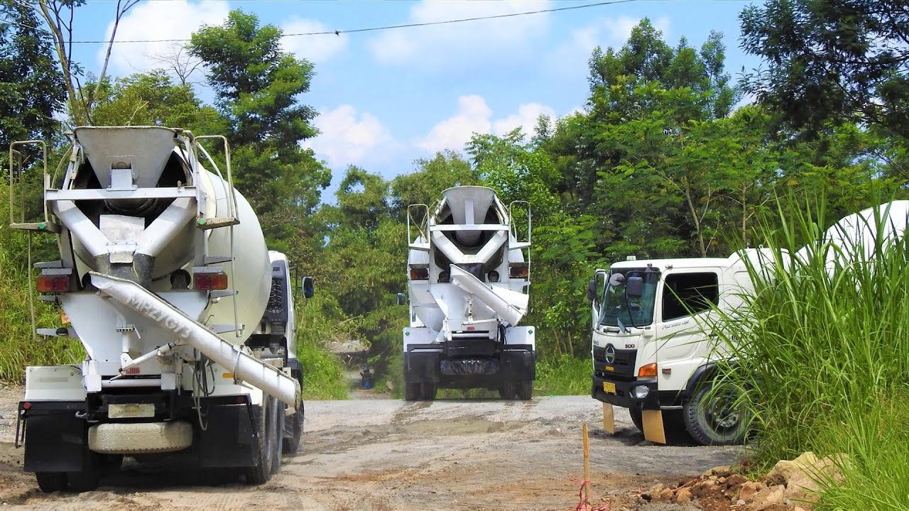 Ready Mix Cement Truck Pouring Concrete On The Bad Road