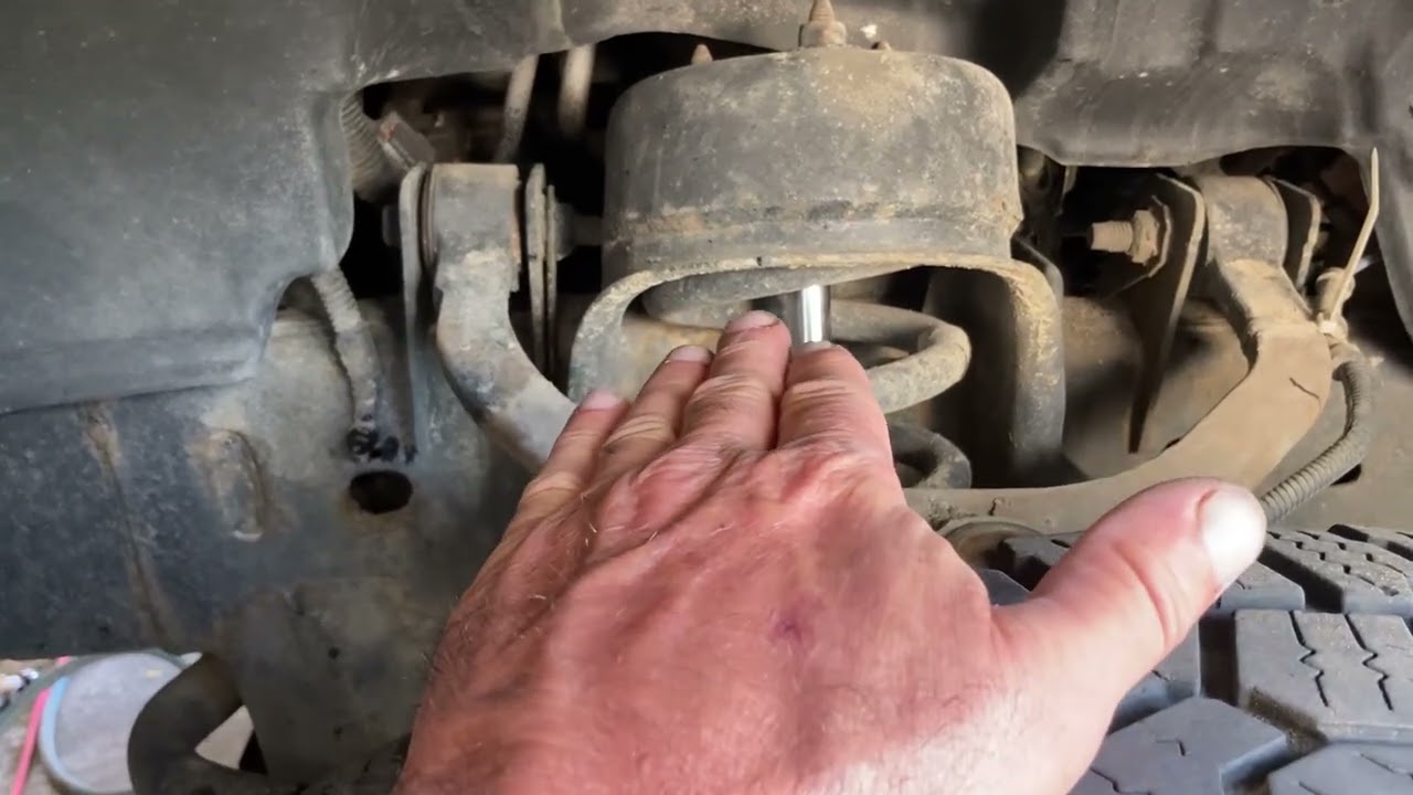 Checking the upper control arm bushing for play