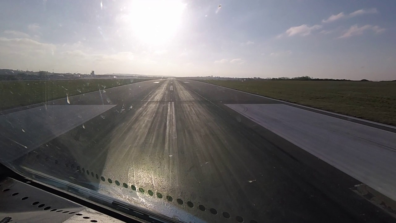 Pilots view of Bristol Airport takeoff into the early morning sun.