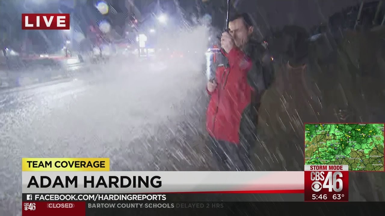 CBS46's Adam Harding gets drenched by passing motorist