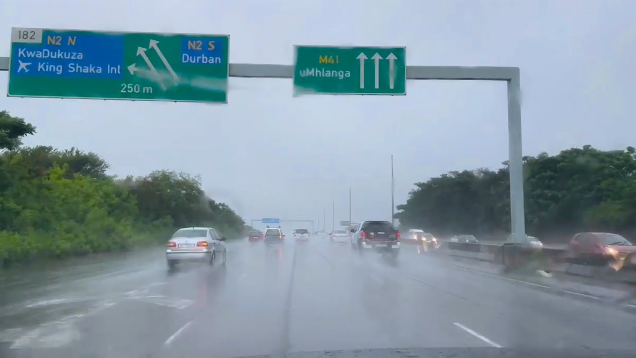 Rainy drive on M4 freeway past Gateway in Umhlanga