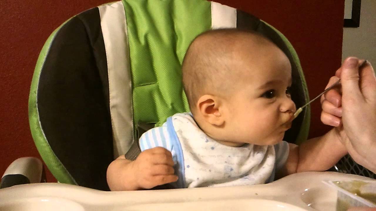 Kayden making baby wookiee sounds as he eats green beans for the first time