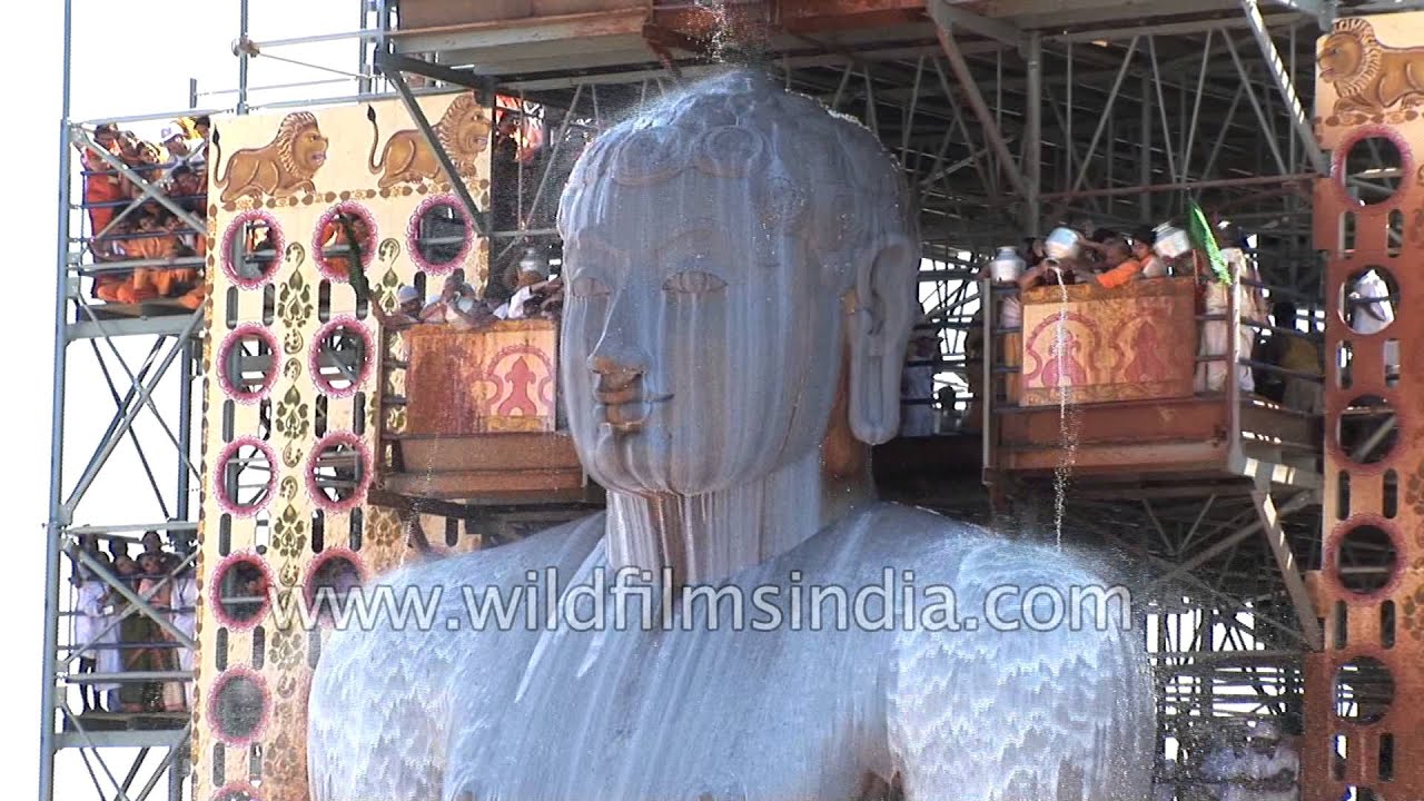 Jain devotees pour milk over the monolithic statue of Bahubali : Mahamastakabhishek, Karnataka