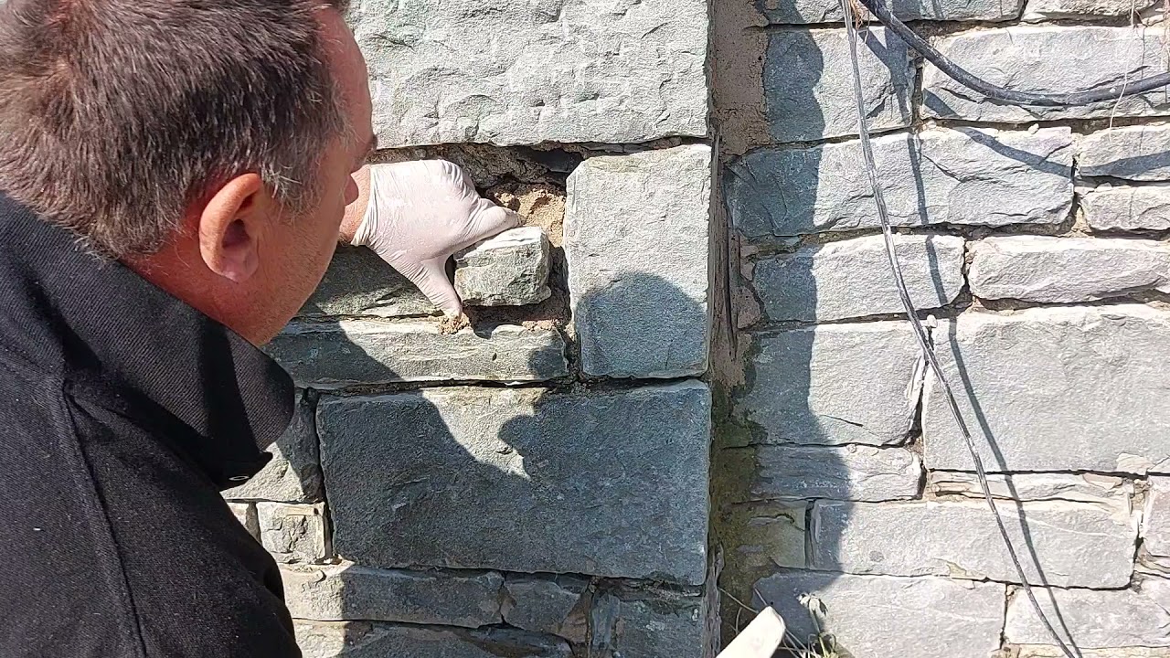 Replacing stone and filling voids and repointing in lime mortar on grade 2 listed building
