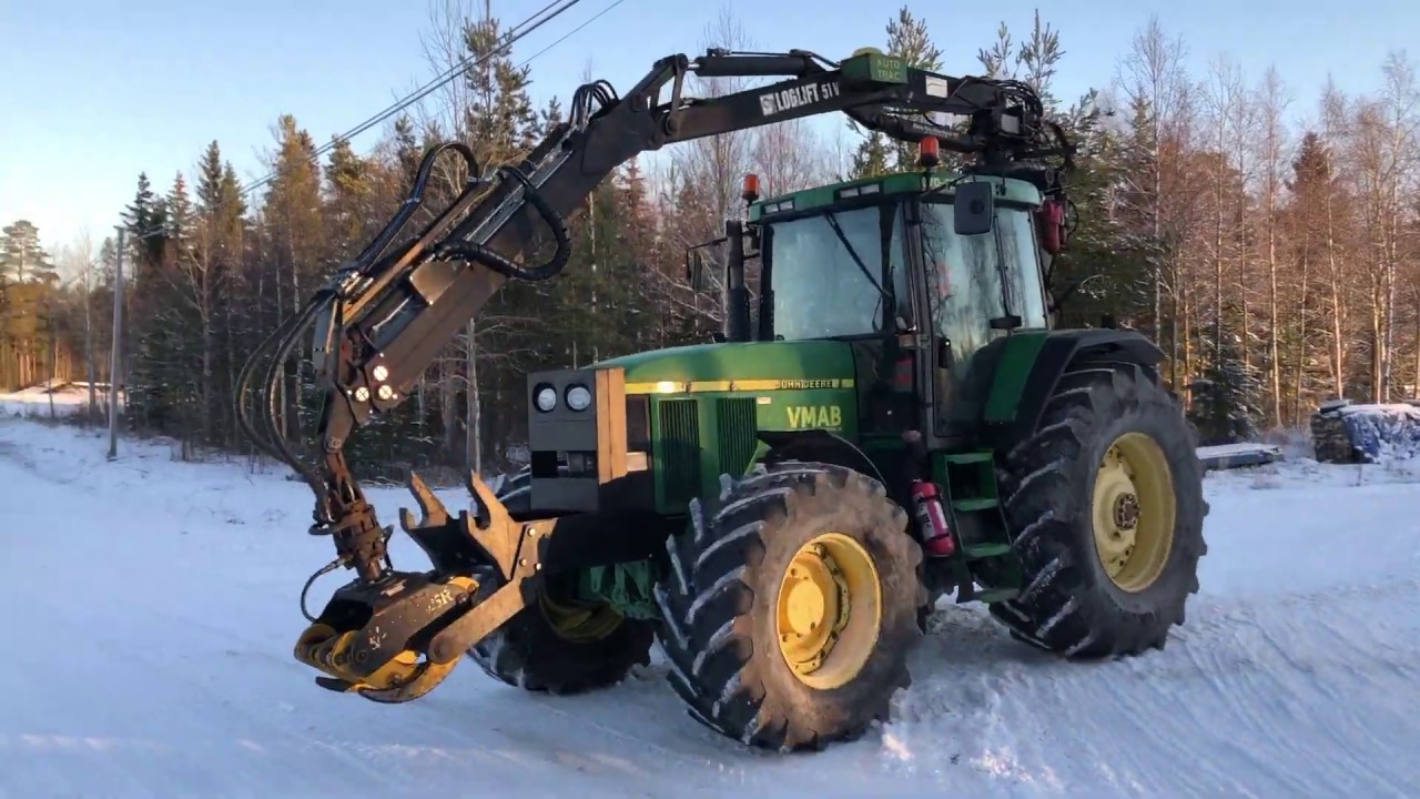 Köp traktor John Deere 7710 med 8 m kran Loglift 51V på Klaravik.se