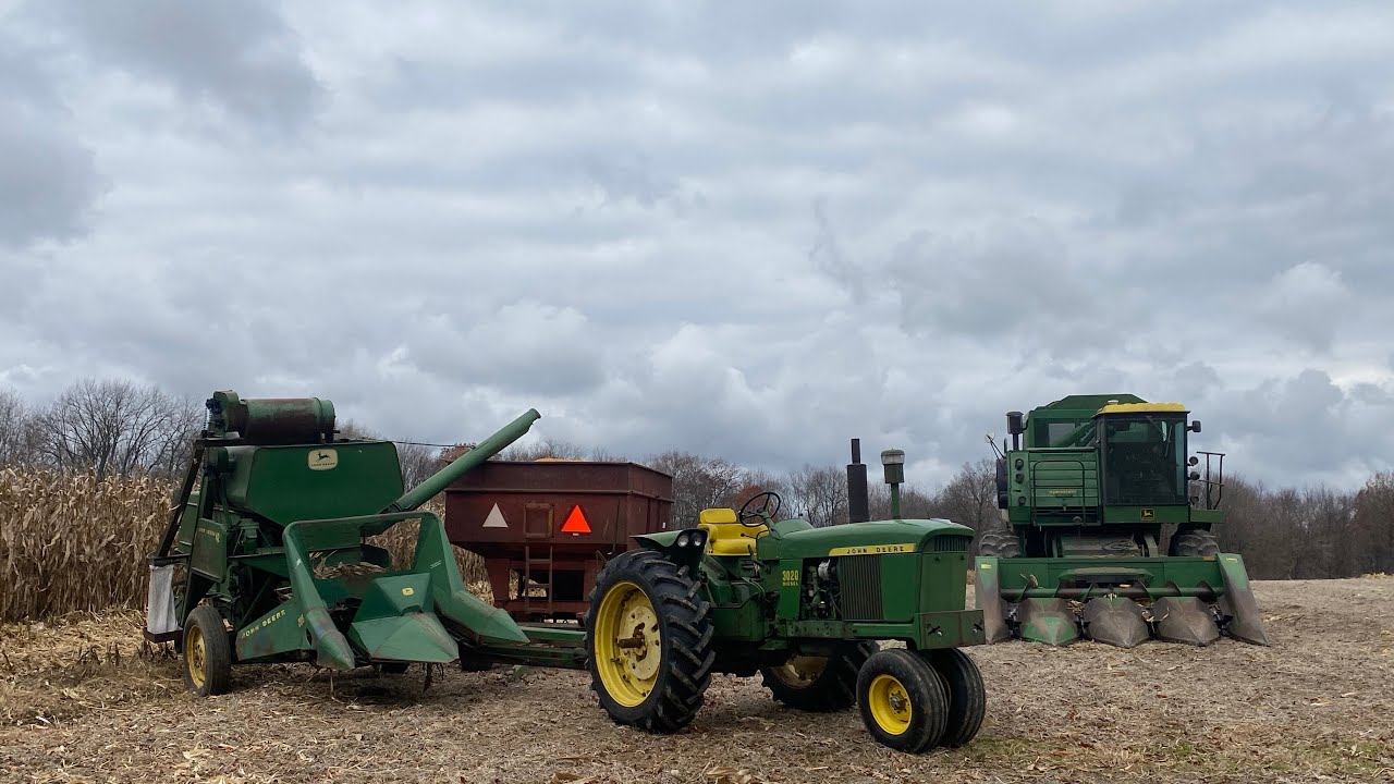 JOHN DEERE 3020 DIESEL AND MODEL 42 PULL TYPE COMBINE IN CORN ACTION