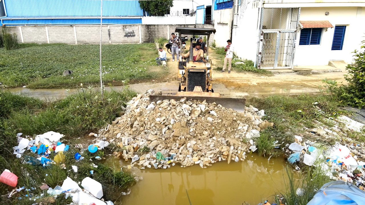 Completed the placement of stones in the new location with multiple machinery and plant debris