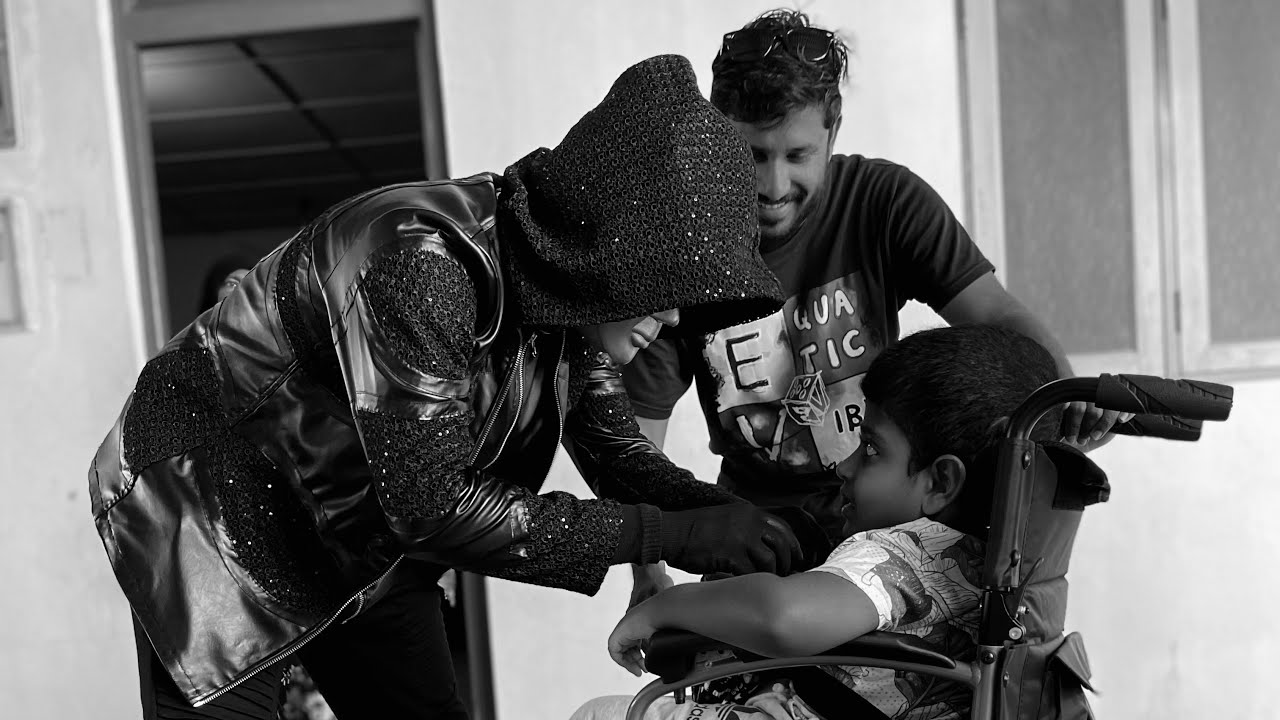 Roboman surprising a kid with a new electric wheelchair!