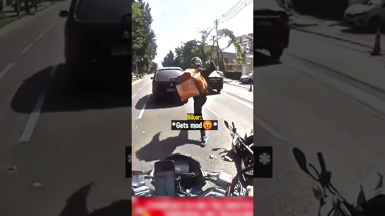 Road Rage Biker Throws Rock at Driver's Car