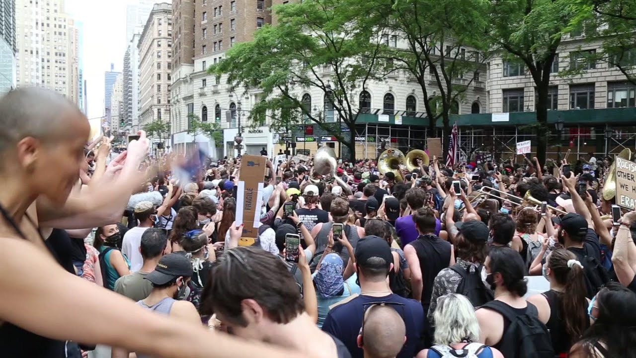 Jon Batiste leads peaceful protest music march