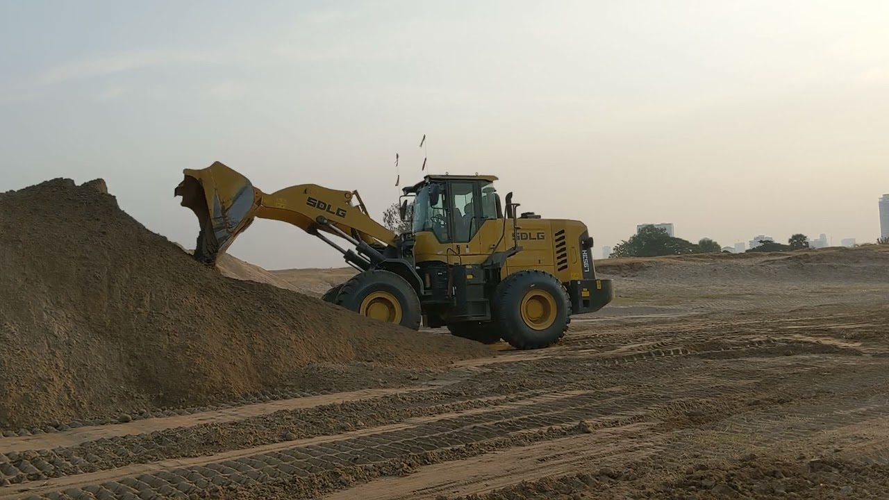 Powerful SDLG Wheel Loader at Working Site with Trucks Filling Land - Best Tractor 2026