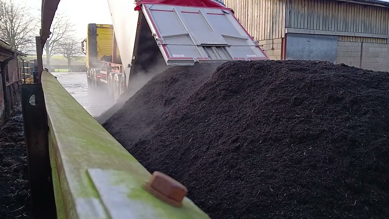 Unloading compost on farm