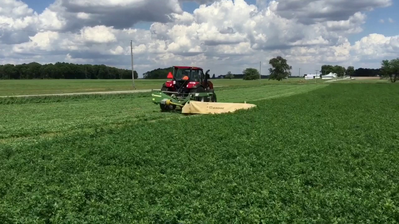 2016 Case IH Farmall 120C and John Deere 6115R with Krone mower and Brillion Alfalfa Seeder. RTK
