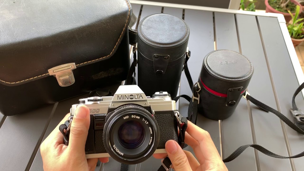 Minolta X300 Film Camera + Minolta 50mm f1.7 MD + Sigma 28mm f2.8 + Zoom Lens + Minolta Flash + Bag