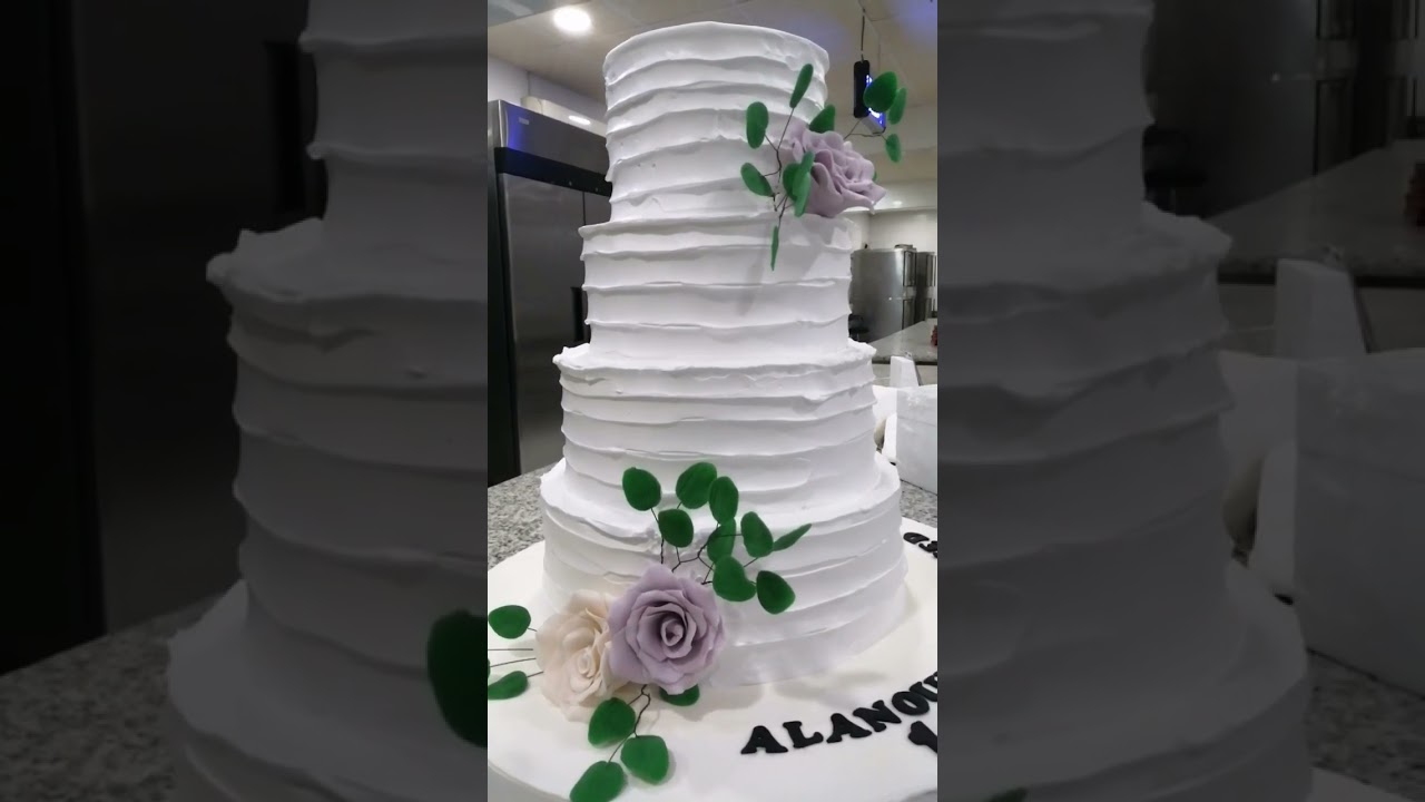 4 tier wedding cake with whipping cream cover 