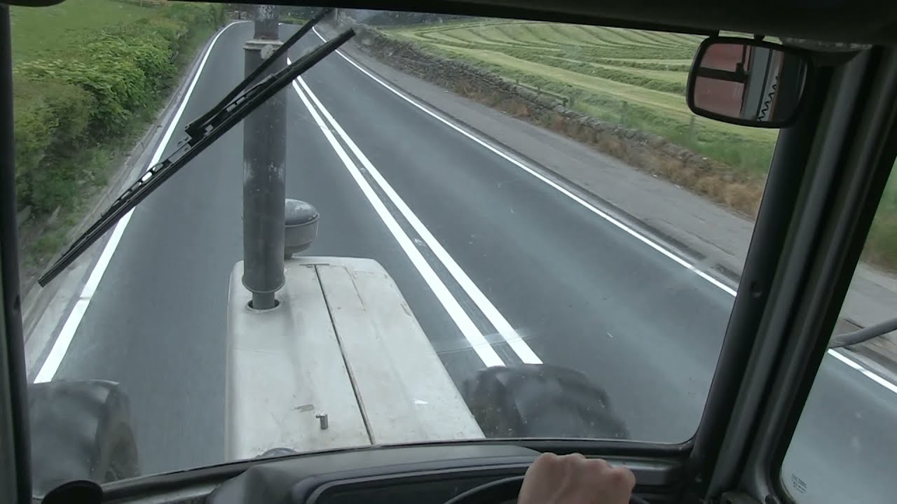 INSIDE CAB OF FORD 7810 III SILVER JUBILEE CARTING GRASS