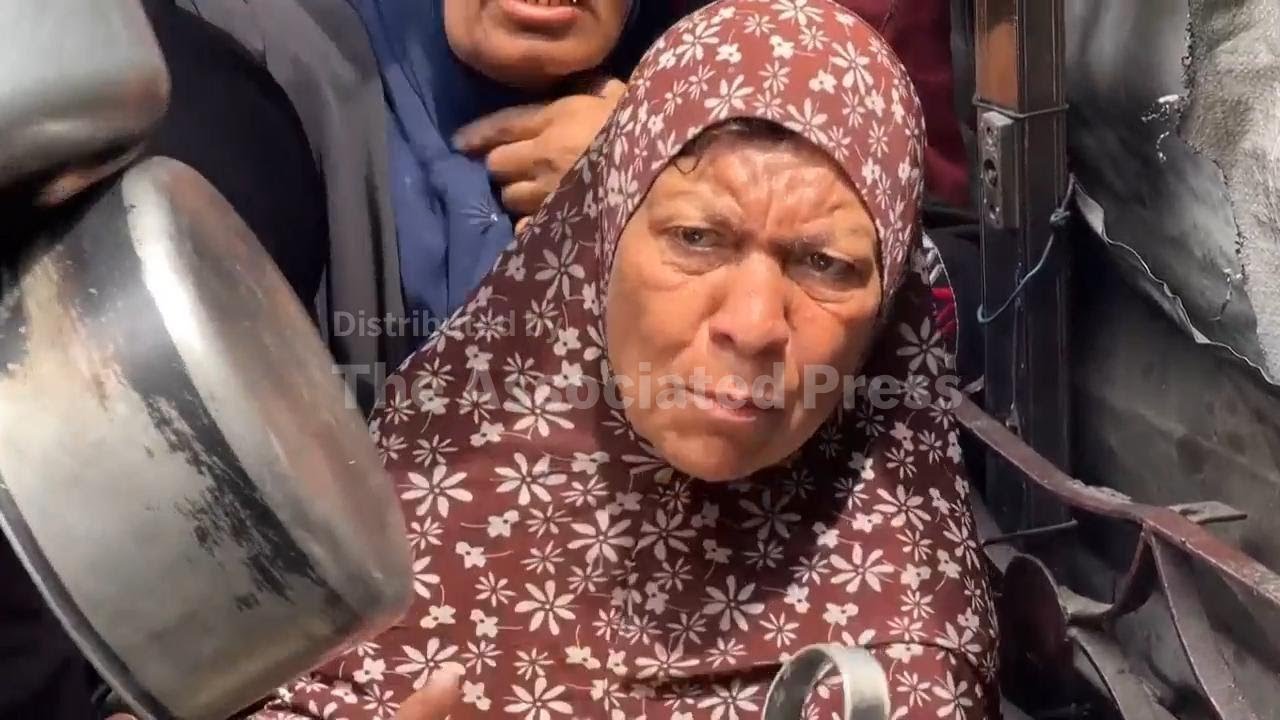 Weary Palestinians line up at food kitchen in northern Gaza Strip as Israeli aid blockade enters thi