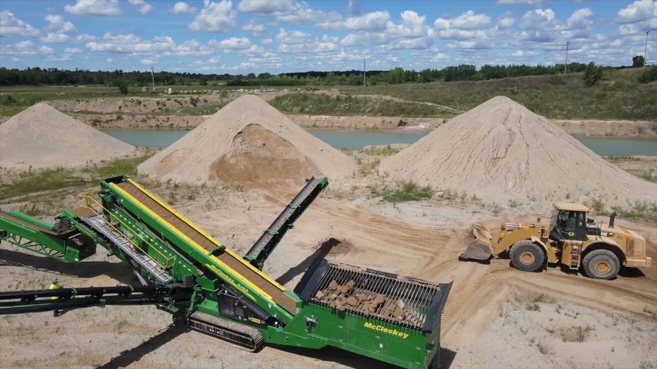 Drone Footage of McCloskey S190 Screener and ST100T Tracked Stacker in Sand and Gravel