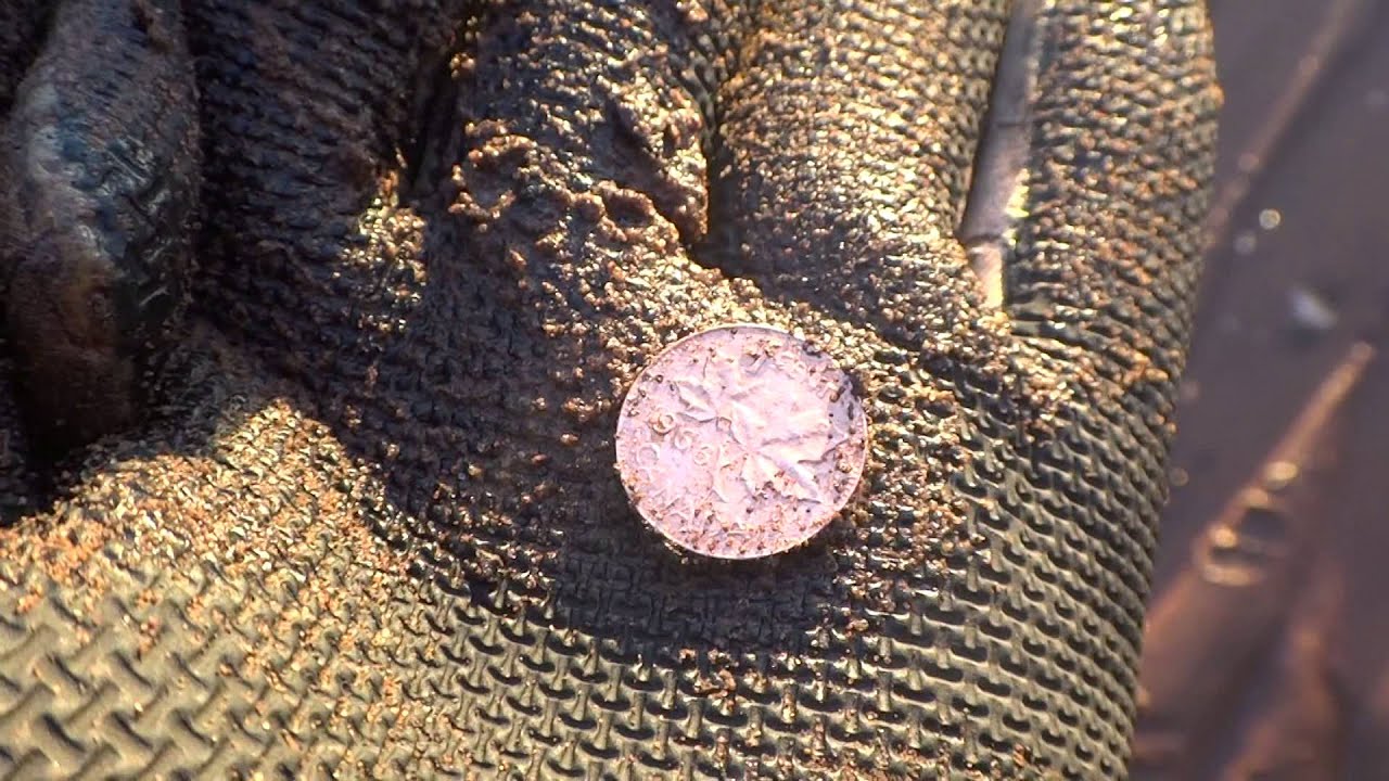 Rings and silver coins under the Atlantic ocean cold in the water