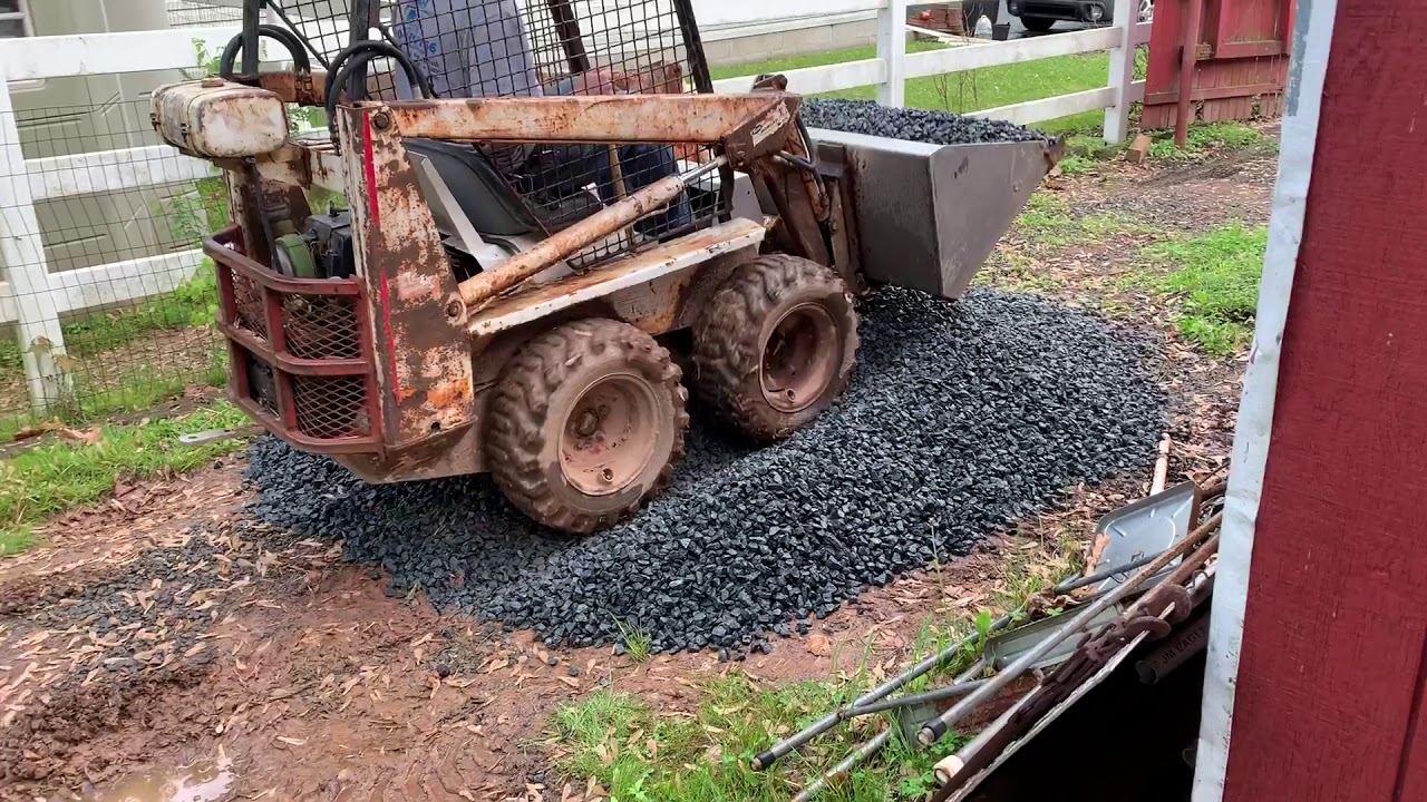 Bobcat M371 moving stone