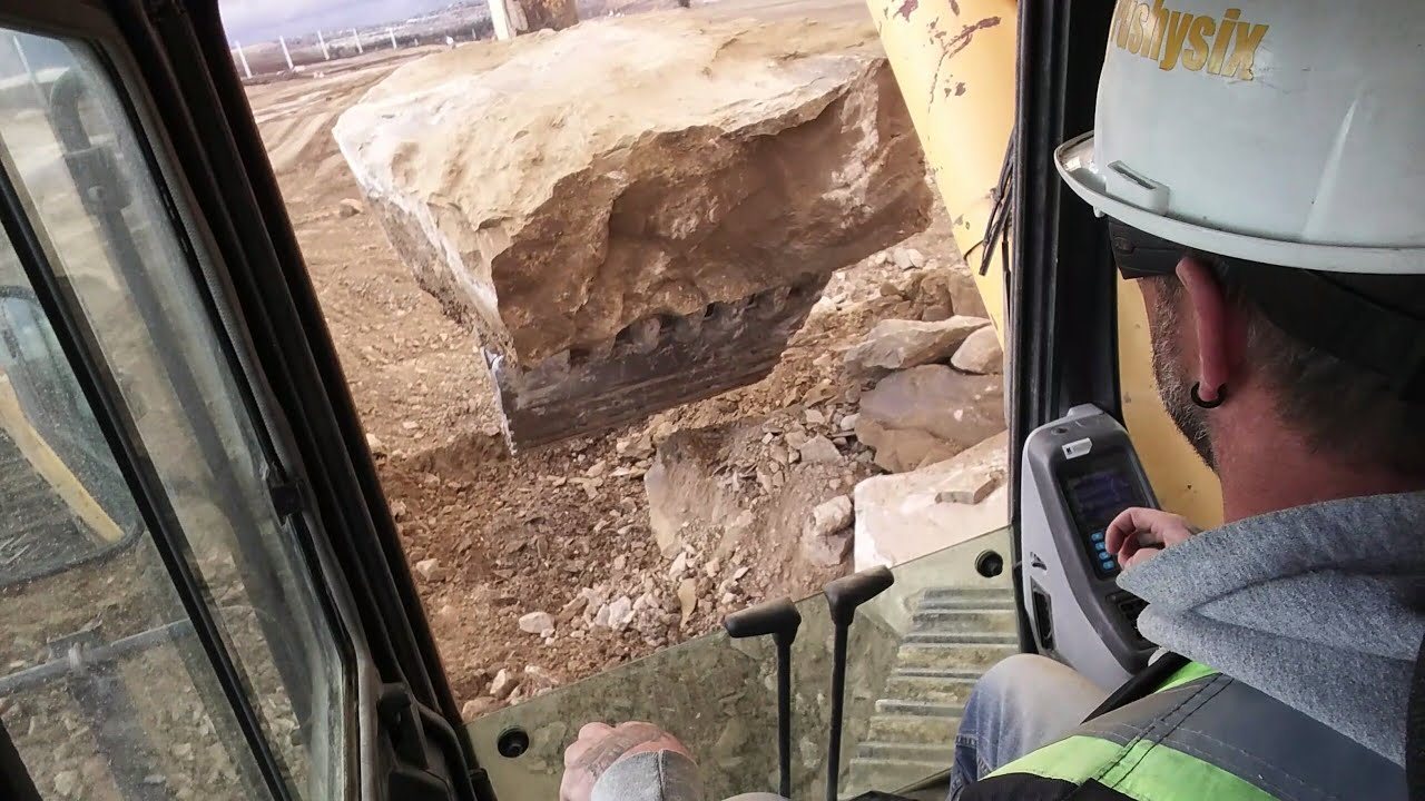 Komatsu 1250 vs Big Ass Rock