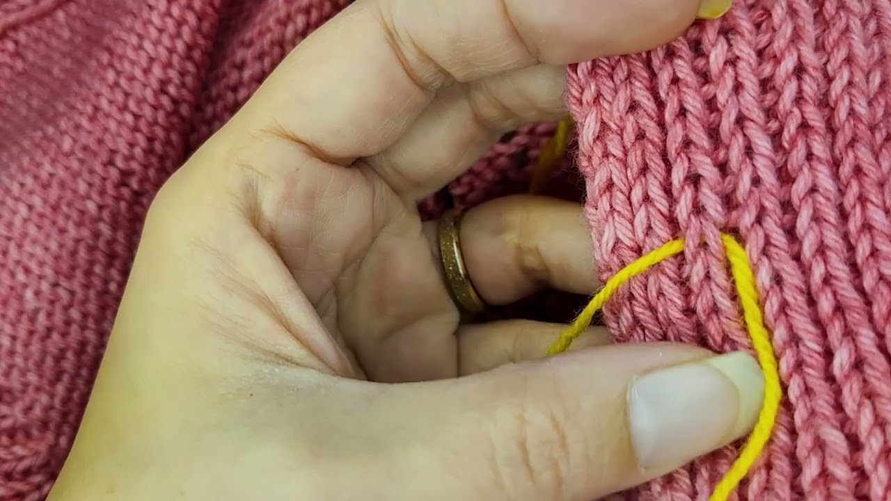Les boutons de A à Z sur un tricot