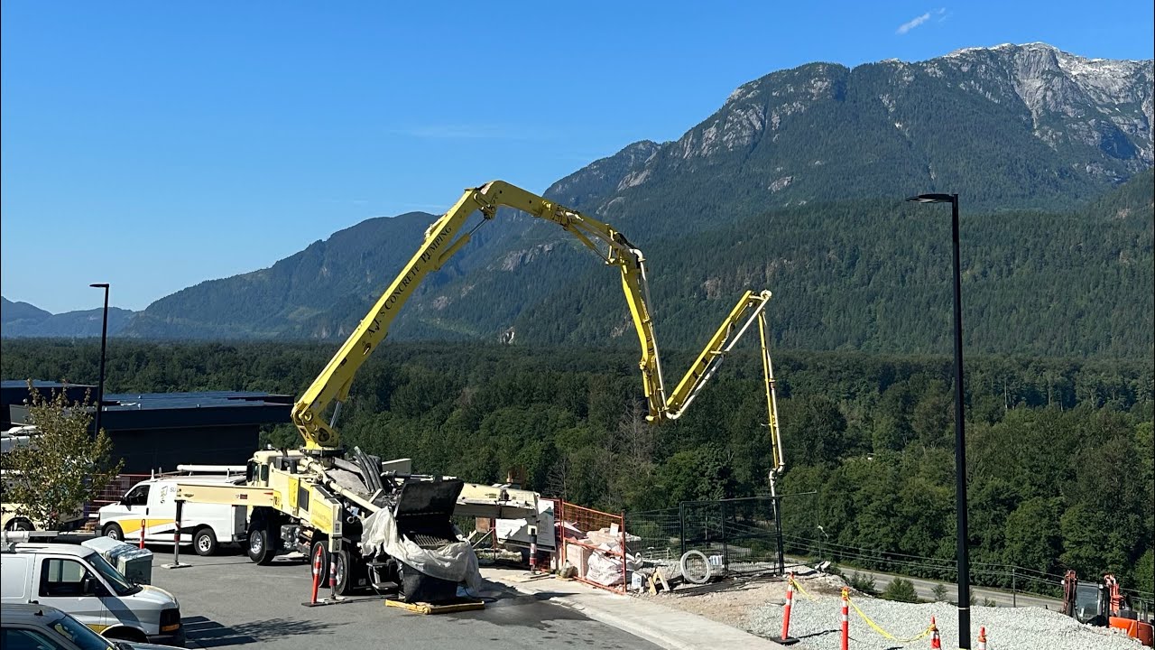 Pumping concrete in the mountains. Ian calls out Muddy Feet!!!