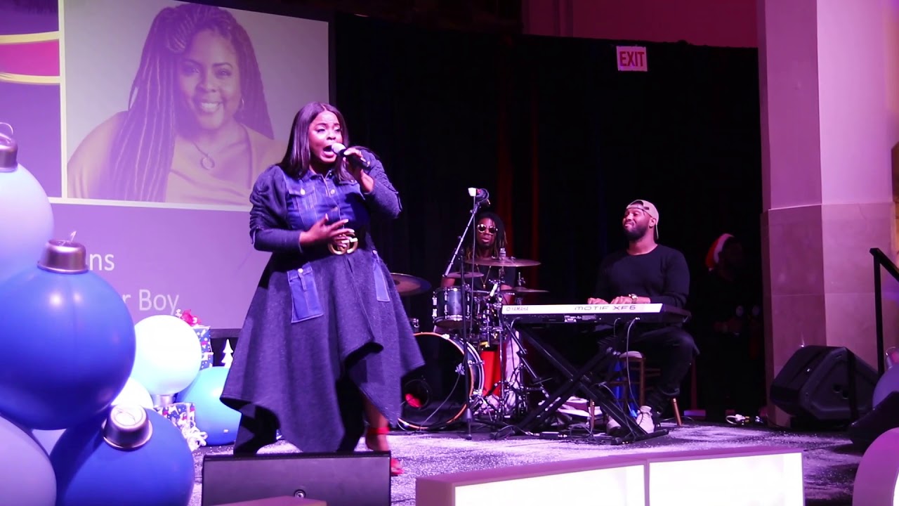 Brely Evans singing at the 7th Annual Caroling with Q Parker and Friends.