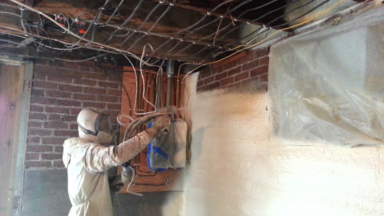 spray foam insulation on basement wall and sill