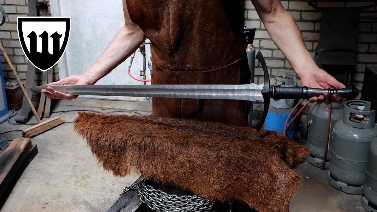 Forging a teardrop Damascus longsword, the complete movie.