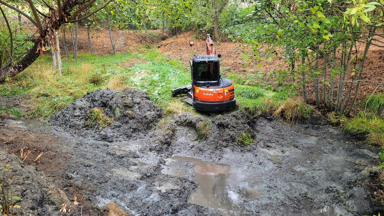 That sinking feeling cleaning a pond Kubota KX-040 excavator